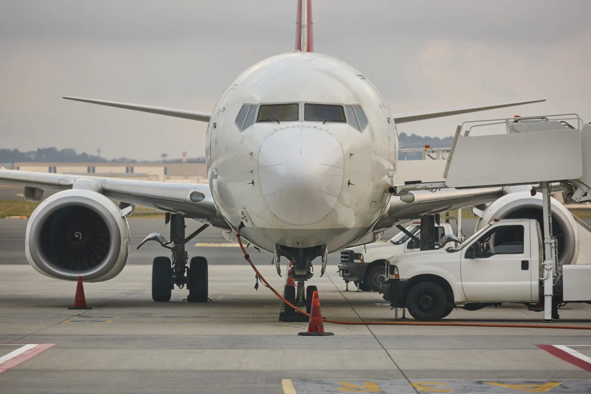 Airplane refueling on the runaway Transportation industry Fuel supply Airplane refueling on the runaway. Transportation industry. Fuel supply