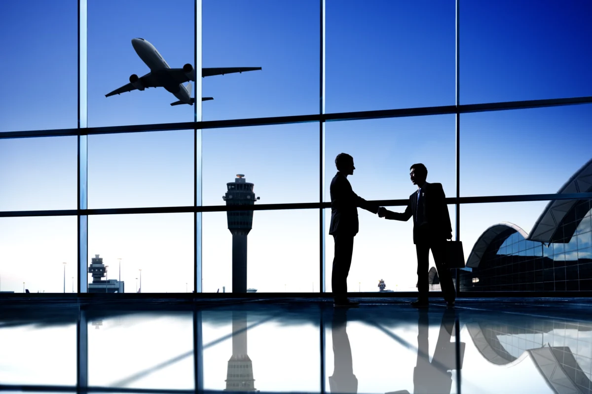 Business people meeting at an airport Business people meeting at an airport