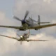 Supermarine Spitfire Mk Vb BM597 JH C G MKVB closes in on Asian Supermarine Spitfire Mk LF III PP972 G BUAR