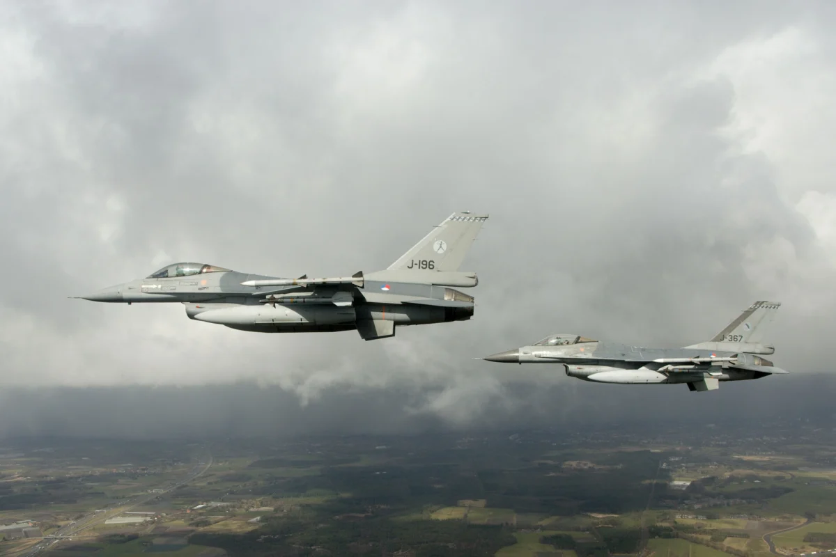 Two Dutch F 16 fighter jets flying in formation Two Dutch F-16 fighter jets flying in formation