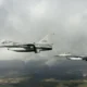 Two Dutch F-16 fighter jets flying in formation