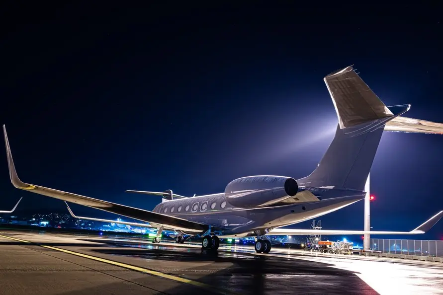 Business jet parked at night Business jet parked at night