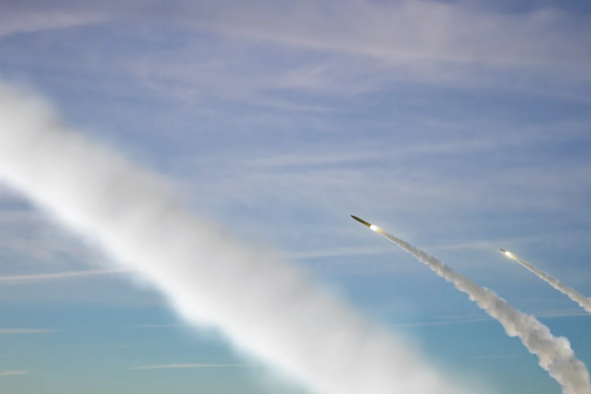 Military rockets are flying against the sky Military rockets are flying against the sky