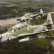 Brazilian Air Force Embraer A-29 Super Tucano aircraft in flight over the Amazon Rainforest