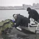 NTSB investigators recovering wreckage of the Sikorsky UH-60 Black Hawk from the Potomac River near Reagan National Airport