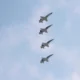 Four Northrop T-38 Talon trainer jets flying in formation