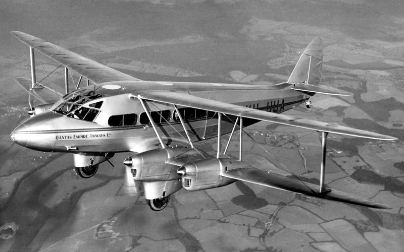 Aerial view of a new Qantas DH86 on a test flight over England in 1934