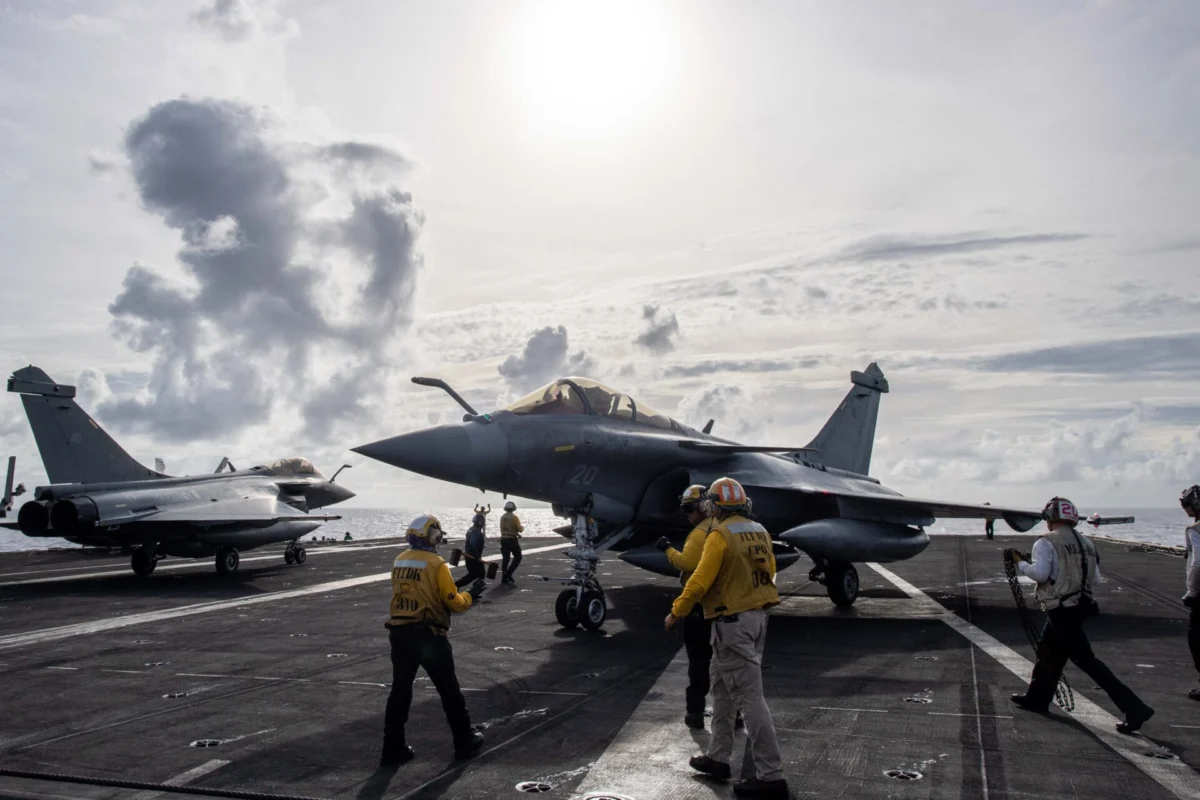 Two Rafale fighter jets on the deck of an aircraft carrier Two Rafale fighter jets on the deck of an aircraft carrier
