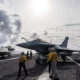 Two Rafale fighter jets on the deck of an aircraft carrier