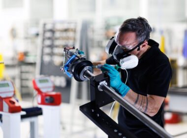 A Collins Aerospace technician applies sealant to an actuator, part of the A350 electric thrust reverser actuation system (elecTRAS) on the new production line in Colomiers, France