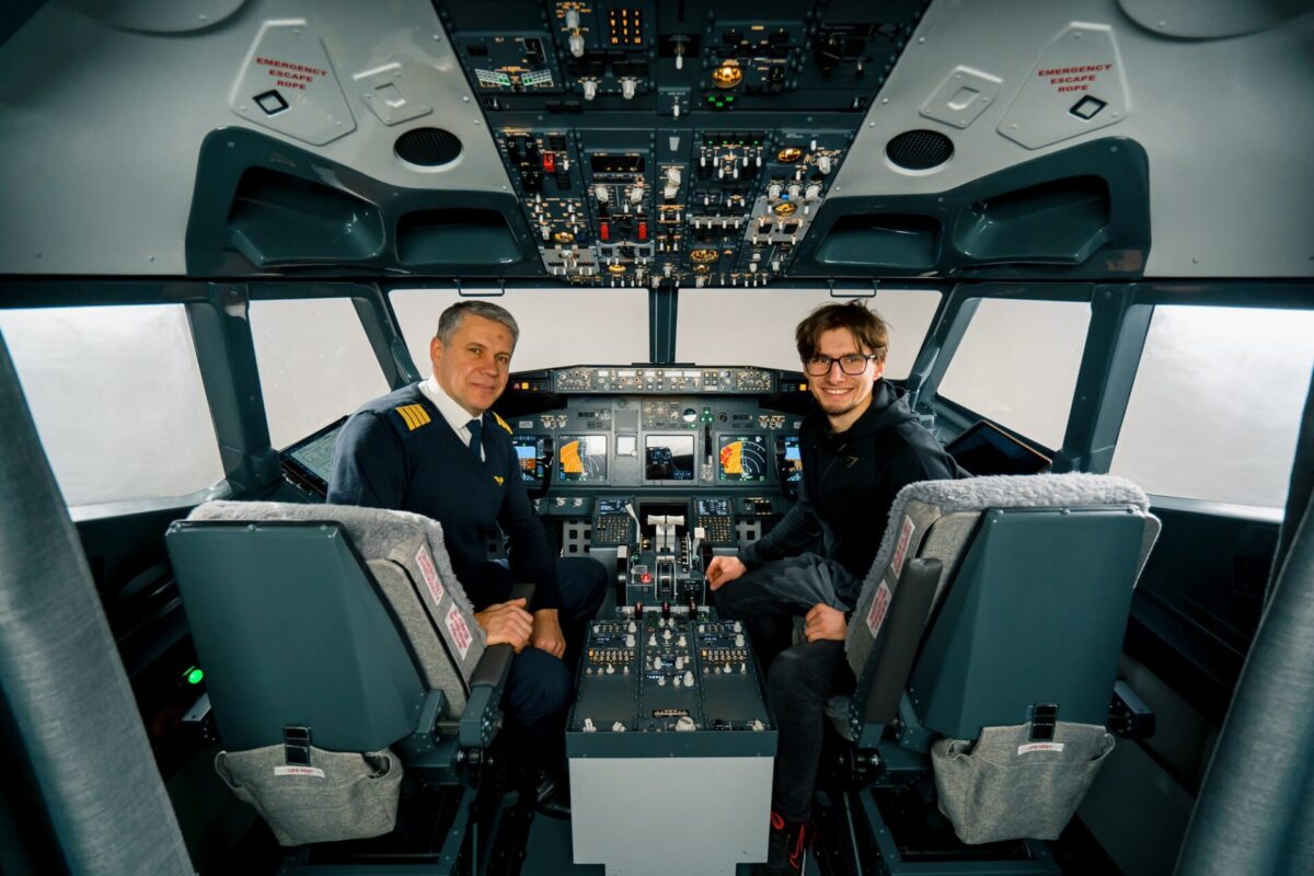 airplane cockpit pilot and young student boy smiling after training on flight simulator entertainment concept
