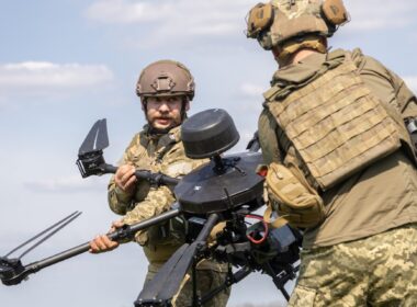 Ukrainian soldiers carrying a Baba Yaga heavy drone