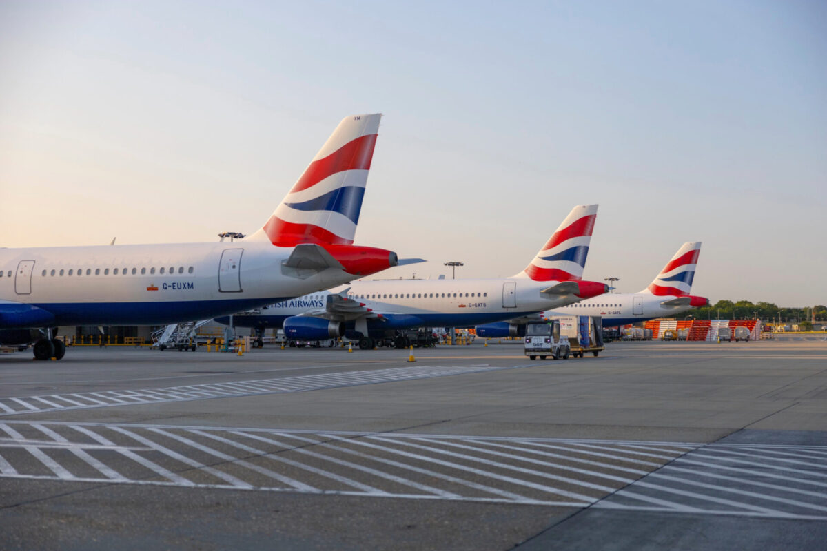 A row of British Airways Airbus A320 parked at gate
