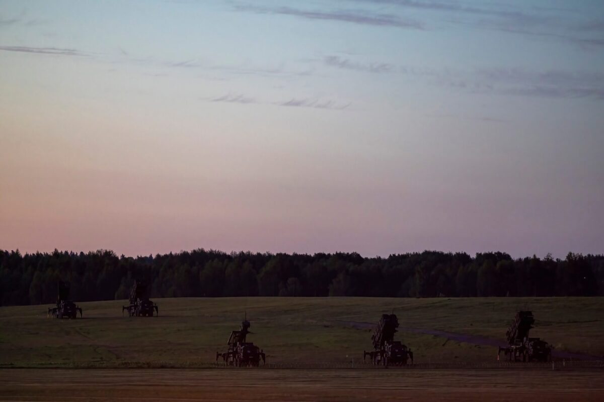 Patriot missile defense launchers stationed in an open field