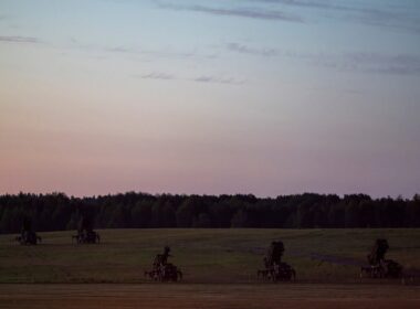 Patriot missile defense launchers stationed in an open field
