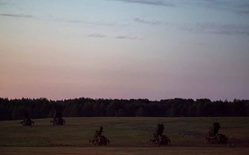 Patriot missile defense launchers stationed in an open field