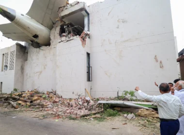 Prime Minister of Bharat, Shri Narendra Damodardas Modi looks on at the wreckage of the crashed Air India Flight 171