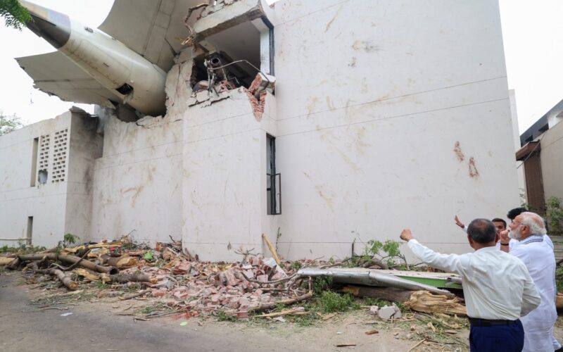 Prime Minister of Bharat Shri Narendra Damodardas Modi looks on at the wreckage of the crashed Air India Flight 171