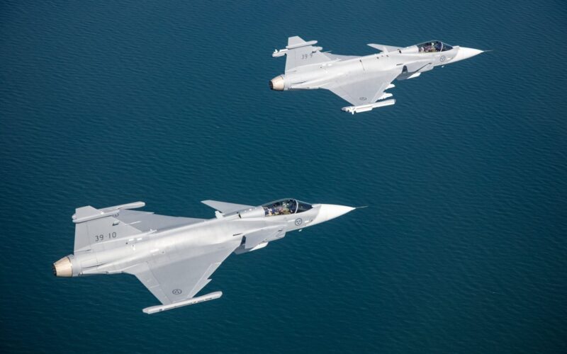 Two Saab Gripen E fighter jets flying in formation