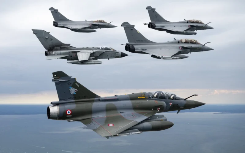 Italian Tornado and French Rafale and Mirage 2000 fighters flying in formation during exercise Volfa 25