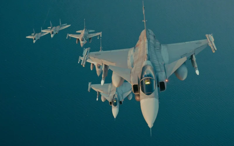 Polish and Swedish fighter jets flying in formation