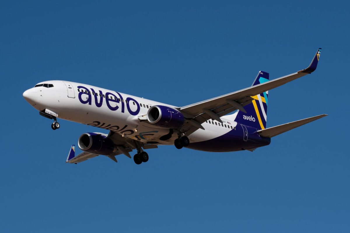 Avelo Airlines Boeing 737 flying against blue sky