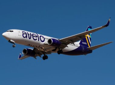 Avelo Airlines Boeing 737 flying against blue sky