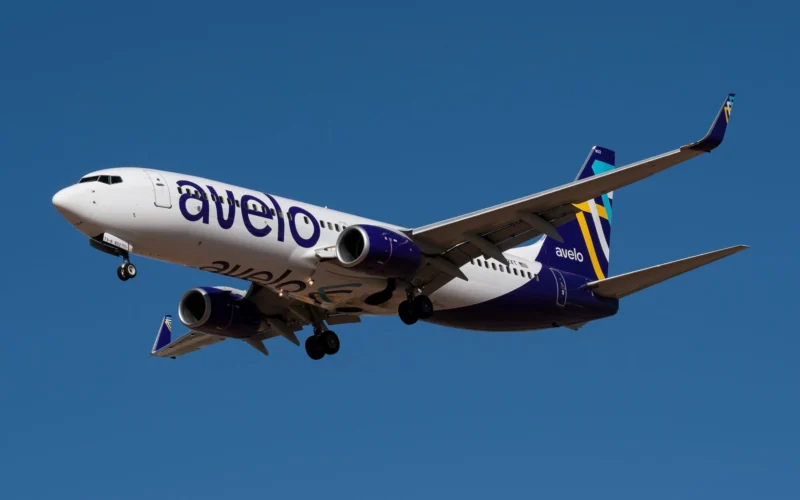 Avelo Airlines Boeing 737 flying against blue sky