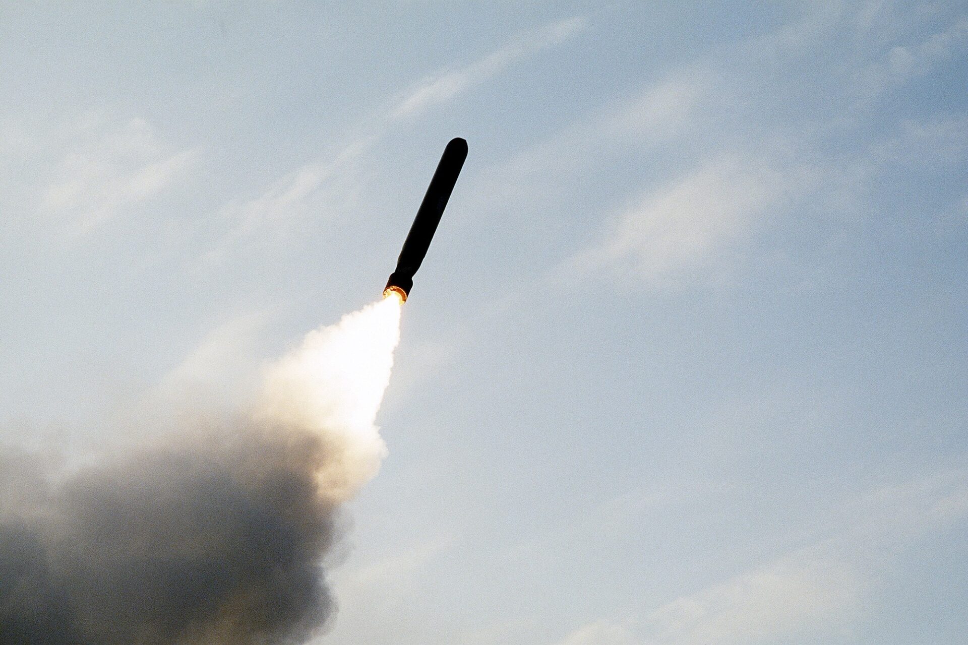 A plume of smoke trails behind a BGM 109 Tomahawk land attack missile