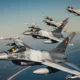Romanian and Polish F 16 fighters flying in formation