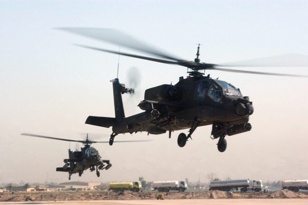 Two US Army AH 64 Apache helicopters Two US Army AH 64 Apache helicopters