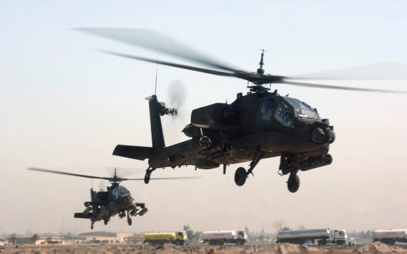 Two US Army AH 64 Apache helicopters