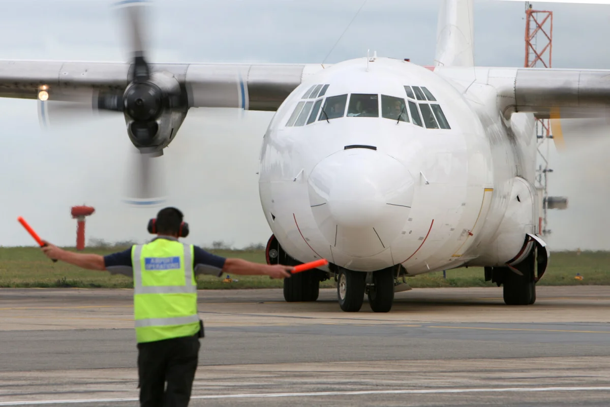 L 100 Hercules freighter aircraft on the runway