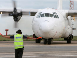 L 100 Hercules freighter aircraft on the runway
