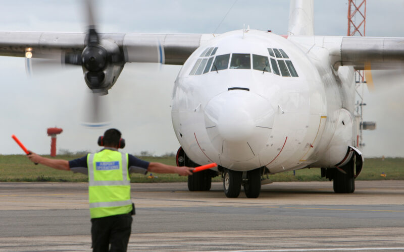 L 100 Hercules freighter aircraft on the runway