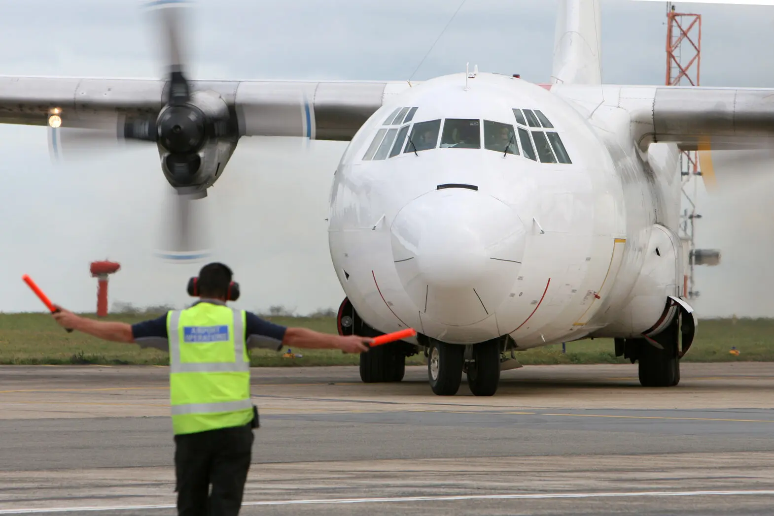L 100 Hercules freighter aircraft on the runway
