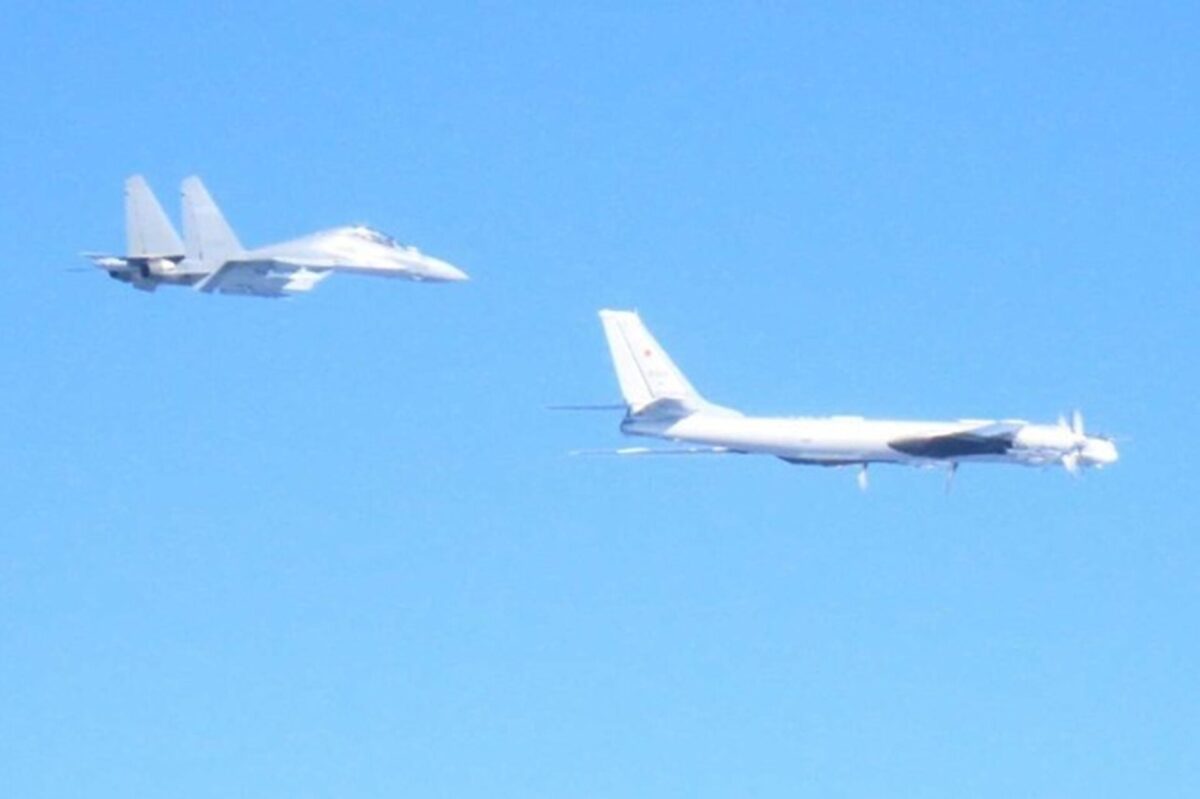 Russian Tu 95 strategic bomber escorted by Chinese J 16 fighter Russian Tu 95 strategic bomber escorted by Chinese J 16 fighter