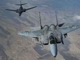 An Israeli Air Force F 15 Strike Eagle in formation with a US Air Force B 1B Lancer