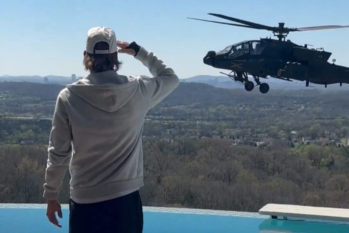 Kid Rock salutes hovering US Army Apache helicopter