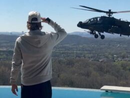 Kid Rock salutes hovering US Army Apache helicopter