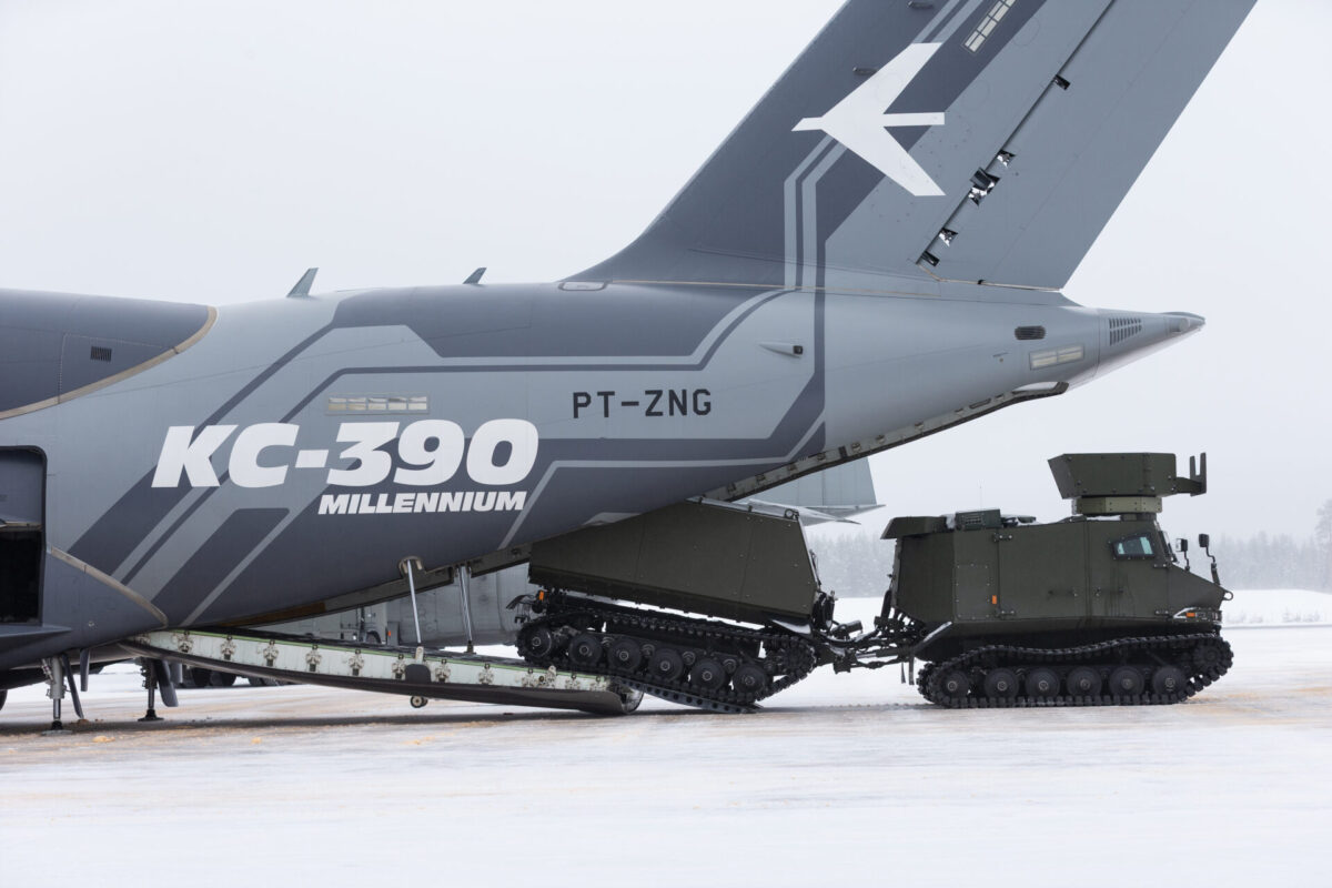 The KC 390 Millennium demonstrator loads a SISU GTT military all terrain vehicle at the Vidsel Test Range in Sweden
