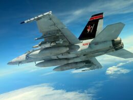 A US Navy FA 18 carries the new Joint Direct Attack Munition JDAM Long Range LR variant