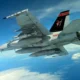 A US Navy FA 18 carries the new Joint Direct Attack Munition JDAM Long Range LR variant