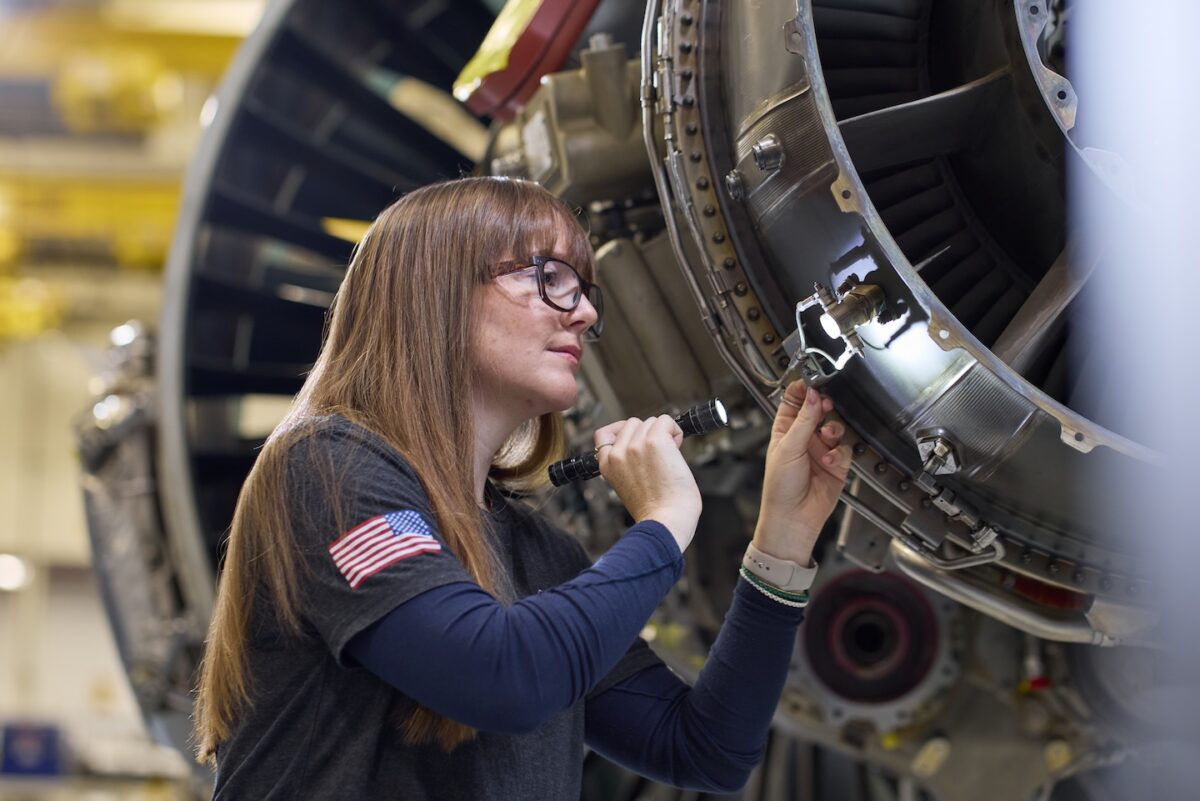 A technician at Pratt & Whitney’s West Palm Beach Engine Center performs a maintenance check on a PW1100G-JM GTF engine (1)
