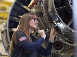 A technician at Pratt & Whitney’s West Palm Beach Engine Center performs a maintenance check on a PW1100G-JM GTF engine (1)