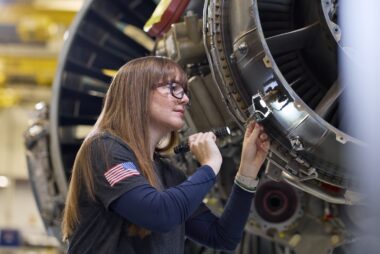 A technician at Pratt & Whitney’s West Palm Beach Engine Center performs a maintenance check on a PW1100G-JM GTF engine (1)
