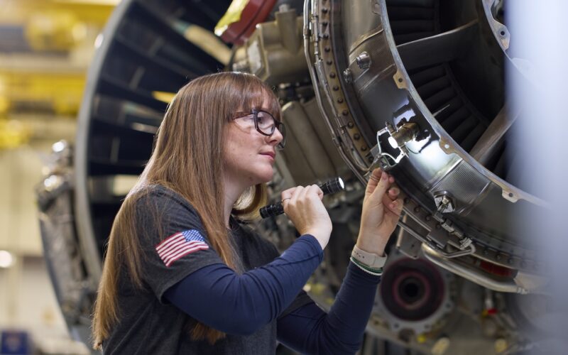 A technician at Pratt & Whitney’s West Palm Beach Engine Center performs a maintenance check on a PW1100G-JM GTF engine (1)