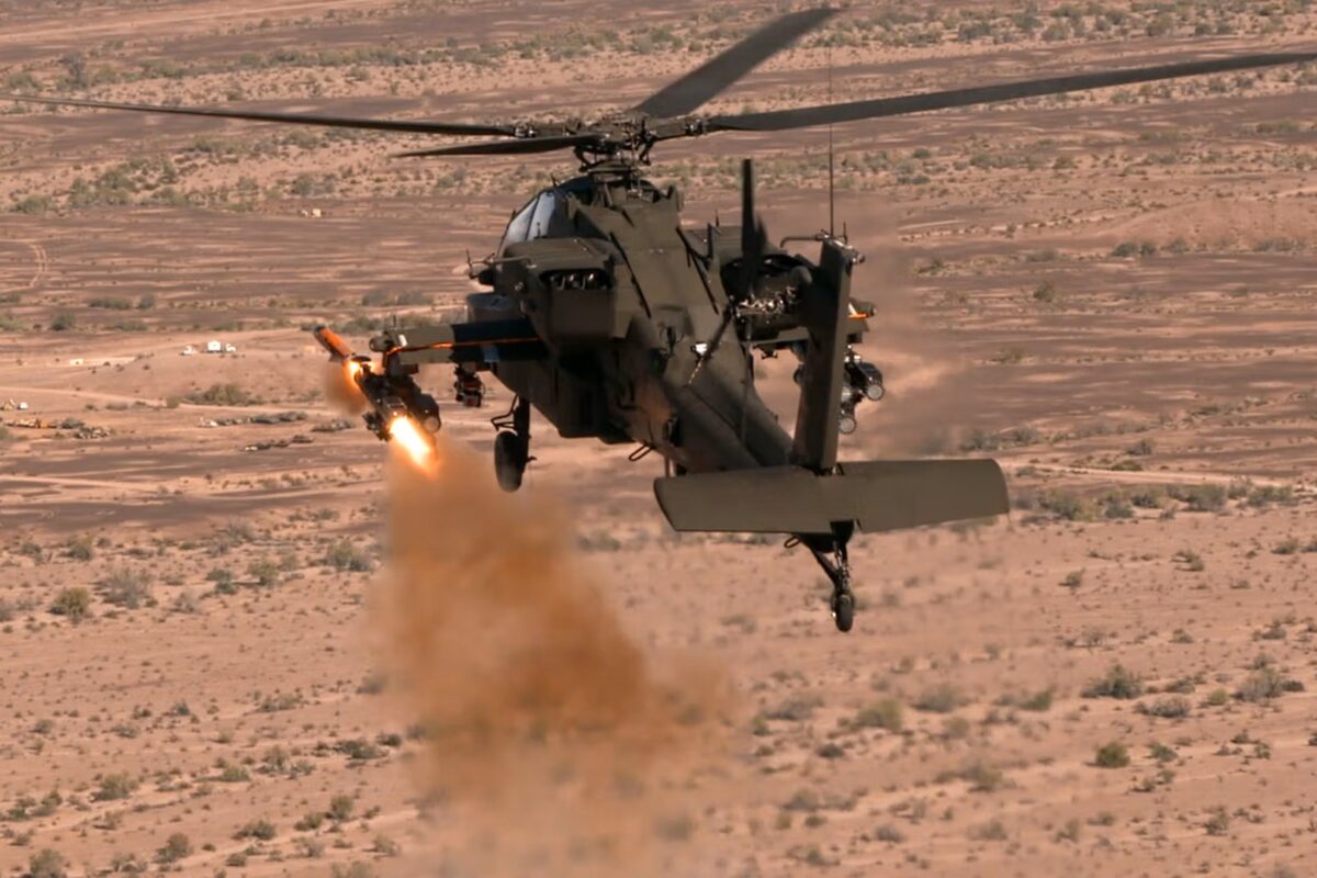 An AH 64 Apache helicopter launches an Altius 700 Medium Range Launched Effect MR LE An AH 64 Apache helicopter launches an Altius 700 Medium Range Launched Effect MR LE