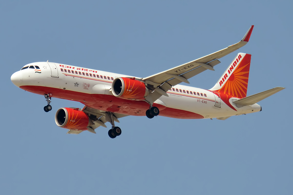 49565080496 ed72da000d o Air India passenger jet in white and orange livery taking off against a clear blue sky landing gear down and visible sunburst tail logo on the tail fin