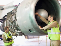 Aircraft workers checking airplane